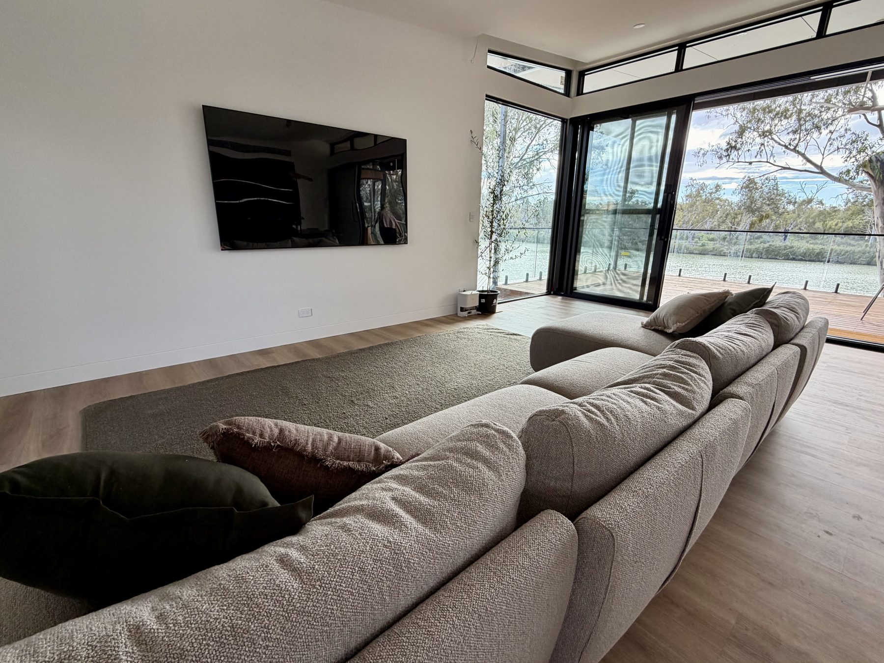 Main living area with sectional sofa and Murray River views