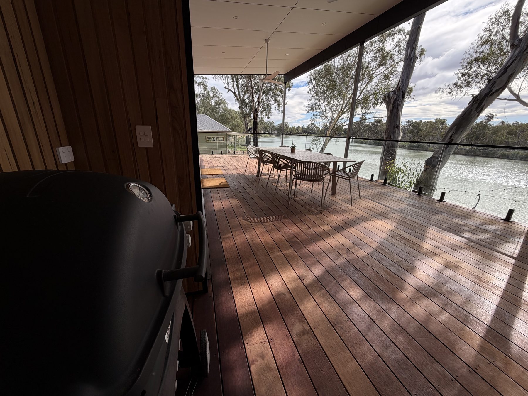 BBQ zone on covered deck overlooking river