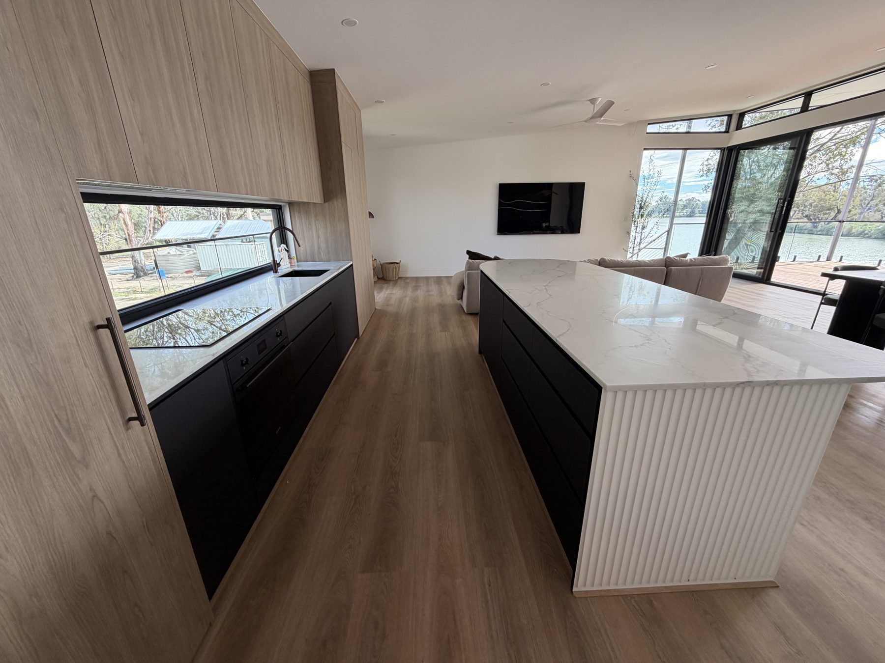 Chef's kitchen with marble island and river view