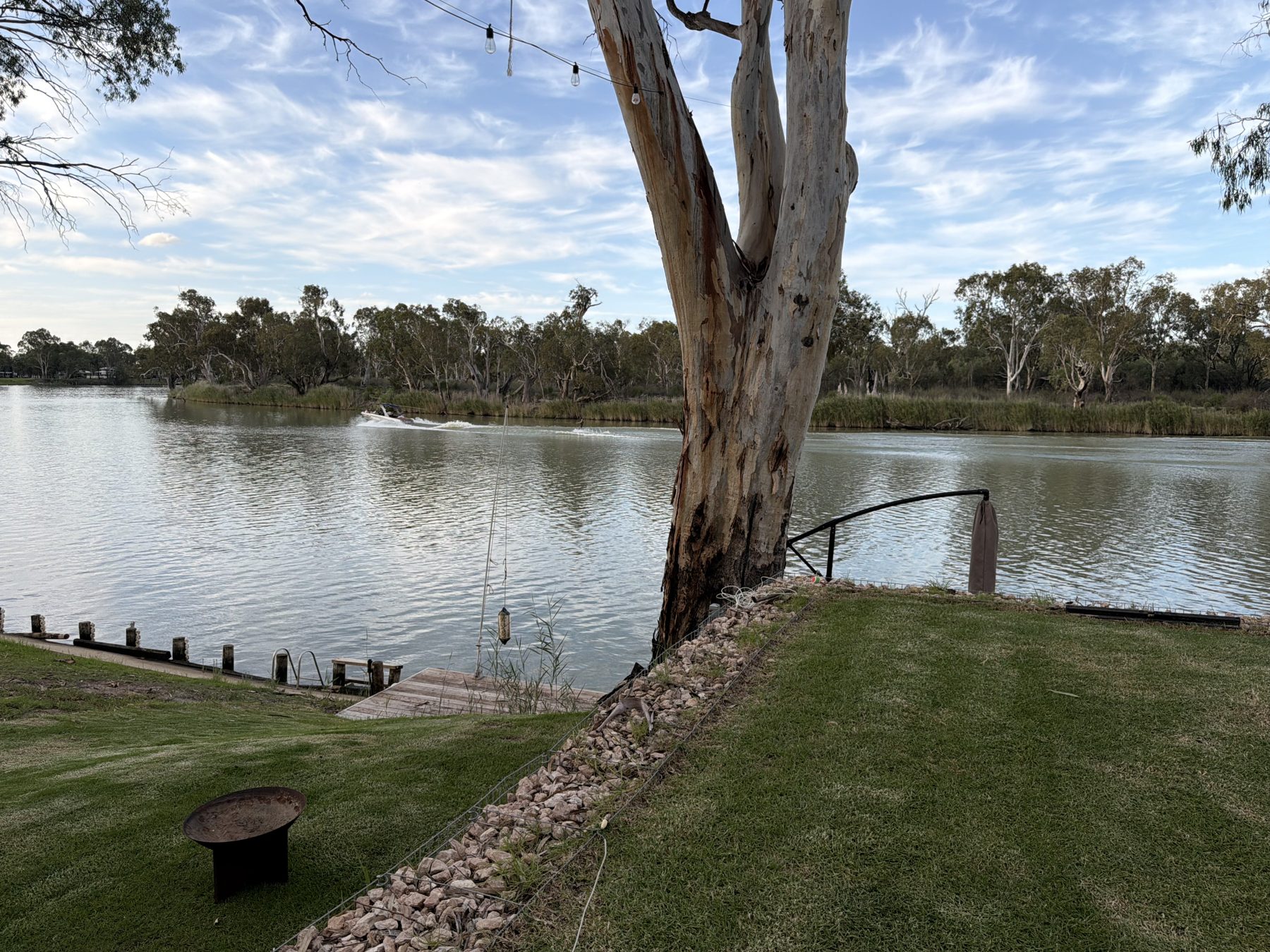 Firepit by the river under the gum trees